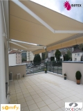 Store coffre Luxia motorisé radio io Somfy toile acrylique Dickson